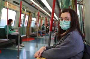 masked girl to protect herself from wuhan virus in public area